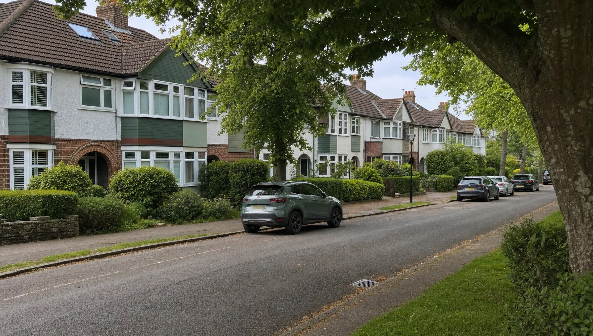 A quiet Uxbridge residential street with 1930s semis, tidy front gardens, mature trees and parked cars, reflecting everyday rental appeal.